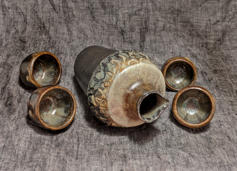 Stoneware Sake Set,Sake Pitcher, Sake Cups, Contemporary Ceramics,Incised and Stretched Clay,Rustic Decor, Wabisabi Ceramics,Wabisabi,Functional Ceramics,Inspired by Nature,Oxides,Sculptural Ceramics,Balance,Hudson Valley Ceramics,Asymmetric,Gregory Arnett Studios,Nature Inspired Design,Tenmoku Glaze,Bas Relief Texture,Handmade,OOAK, One of a Kind